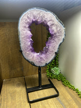 Load image into Gallery viewer, Amethyst Crystal geode slice on black display stand