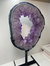 Load image into Gallery viewer, Amethyst Crystal geode slice on black display stand