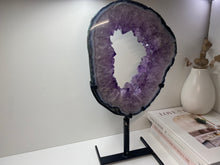 Load image into Gallery viewer, Amethyst Crystal geode slice on black display stand