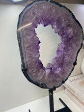 Load image into Gallery viewer, Amethyst Crystal geode slice on black display stand