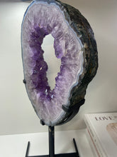 Load image into Gallery viewer, Amethyst Crystal geode slice on black display stand