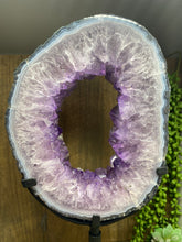 Load image into Gallery viewer, Amethyst Crystal geode slice on black display stand