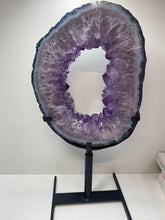 Load image into Gallery viewer, Amethyst Crystal geode slice on black display stand
