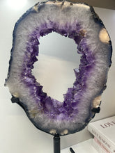 Load image into Gallery viewer, Amethyst Crystal geode slice on black display stand