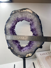 Load image into Gallery viewer, Amethyst Crystal geode slice on black display stand