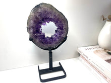 Load image into Gallery viewer, Amethyst Crystal geode slice on black display stand