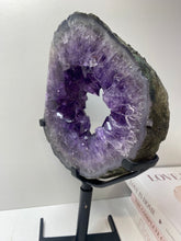 Load image into Gallery viewer, Amethyst Crystal geode slice on black display stand