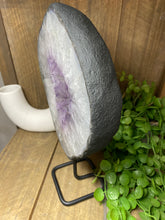 Load image into Gallery viewer, Amethyst Crystal geode slice on black display stand