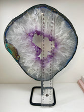 Load image into Gallery viewer, Amethyst Crystal geode slice on black display stand