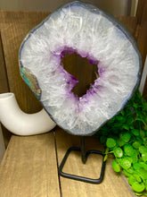 Load image into Gallery viewer, Amethyst Crystal geode slice on black display stand