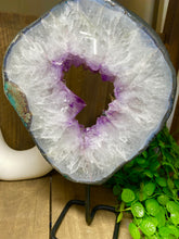 Load image into Gallery viewer, Amethyst Crystal geode slice on black display stand