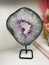 Load image into Gallery viewer, Amethyst Crystal geode slice on black display stand