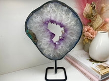 Load image into Gallery viewer, Amethyst Crystal geode slice on black display stand