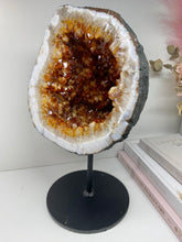 Load image into Gallery viewer, Large Citrine cave on black stand
