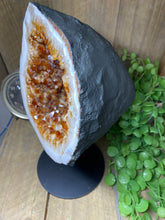 Load image into Gallery viewer, Large Citrine cave on black stand