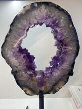 Load image into Gallery viewer, Amethyst Crystal geode slice on black display stand