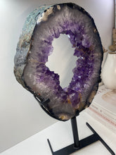 Load image into Gallery viewer, Amethyst Crystal geode slice on black display stand