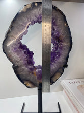 Load image into Gallery viewer, Amethyst Crystal geode slice on black display stand