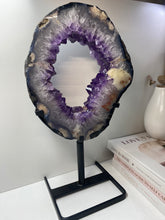 Load image into Gallery viewer, Amethyst Crystal geode slice on black display stand