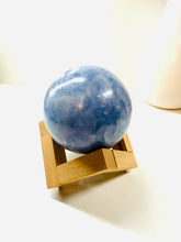 Load image into Gallery viewer, Natural Blue Calcite sphere on wooden stand