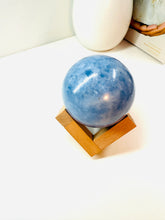 Load image into Gallery viewer, Natural Blue Calcite sphere on wooden stand