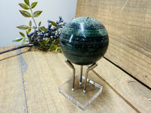 Load image into Gallery viewer, Polished Green Hair Jasper sphere on stand