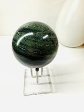 Load image into Gallery viewer, Polished Green Hair Jasper sphere on stand