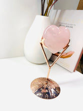 Load image into Gallery viewer, Polished Rose Quartz love heart on rose colored metal stand with zodiac sign
