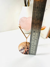 Load image into Gallery viewer, Polished Rose Quartz love heart on rose colored metal stand with zodiac sign
