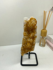 Small Citrine crystal on black stand