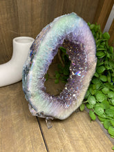 Load image into Gallery viewer, Titanian coated Amethyst Crystal geode slice on display stand