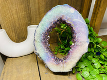 Load image into Gallery viewer, Titanian coated Amethyst Crystal geode slice on display stand