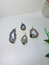 Load image into Gallery viewer, Natural Agate Geode pendant with Gold Electroplating around the edges and Amethyst point in the middle - necklace