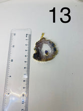 Load image into Gallery viewer, Natural Agate Geode pendant with Gold Electroplating around the edges and Amethyst point in the middle - necklace