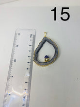 Load image into Gallery viewer, Natural Agate Geode pendant with Gold Electroplating around the edges and Amethyst point in the middle - necklace