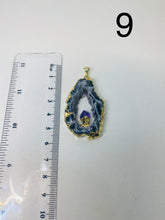 Load image into Gallery viewer, Natural Agate Geode pendant with Gold Electroplating around the edges and Amethyst point in the middle - necklace