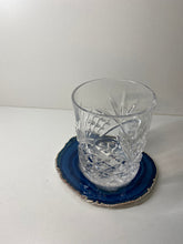 Load image into Gallery viewer, Blue polished Agate Slice drink coaster with silver electroplating around the edges