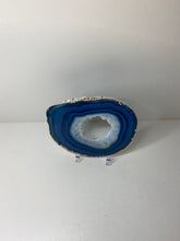 Load image into Gallery viewer, Blue polished Agate Slice drink coaster with silver electroplating around the edges