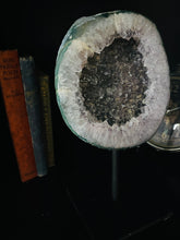 Load image into Gallery viewer, Large Natural Agate Geode with Quartz crystals inside on black stand
