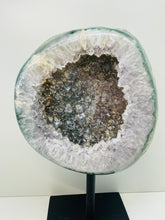 Load image into Gallery viewer, Large Natural Agate Geode with Quartz crystals inside on black stand