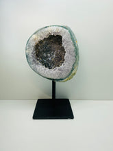 Load image into Gallery viewer, Large Natural Agate Geode with Quartz crystals inside on black stand