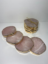 Load image into Gallery viewer, Rose Quartz slice drink coasters with gold electroplating around the edges