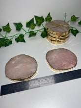 Load image into Gallery viewer, Rose Quartz slice drink coasters with gold electroplating around the edges