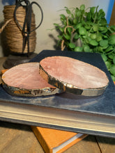 Load image into Gallery viewer, Rose Quartz slice drink coasters with gold electroplating around the edges