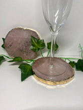 Load image into Gallery viewer, Rose Quartz slice drink coasters with gold electroplating around the edges