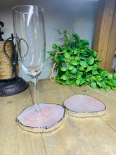 Load image into Gallery viewer, Rose Quartz slice drink coasters with silver electroplating around the edges