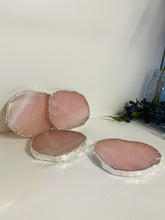 Load image into Gallery viewer, Rose Quartz slice drink coasters with silver electroplating around the edges