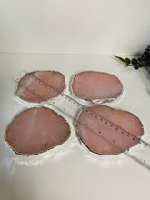 Load image into Gallery viewer, Rose Quartz slice drink coasters with silver electroplating around the edges