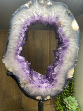 Load image into Gallery viewer, Amethyst Crystal geode slice on black display stand