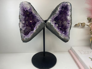 Amethyst Crystal geode wings on black display stand